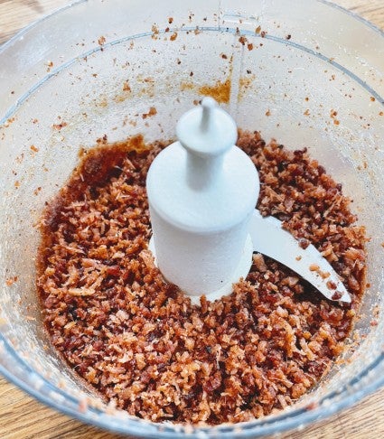 Candied bacon processed in a mini food processor until finely crumbled.