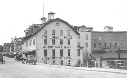 An undated photo in black and white of an old milling facility