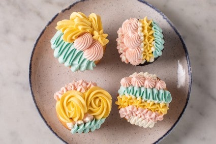 Cupcakes decorated with a mix of frosting designs