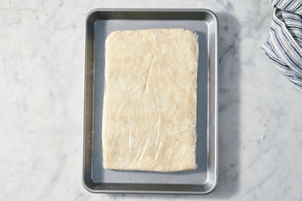 Rectangle of pie dough wrapped and ready to chill
