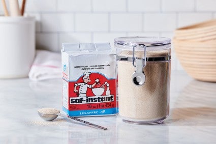 Instant dry yeast on kitchen work surface 