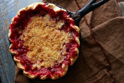 Plum pie baked in a cast iron pan