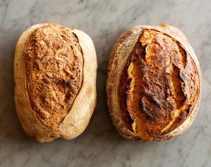 Two loaves, one with steam and one without